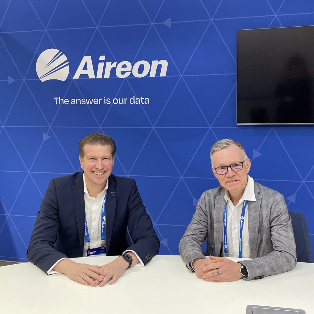 Aireon VP of Customer Affairs Peter Cabooter (left) and Christof Schäfer, Partnerships Director at Airbus, celebrate the signing of an expanded data distribution agreement between the two companies. 